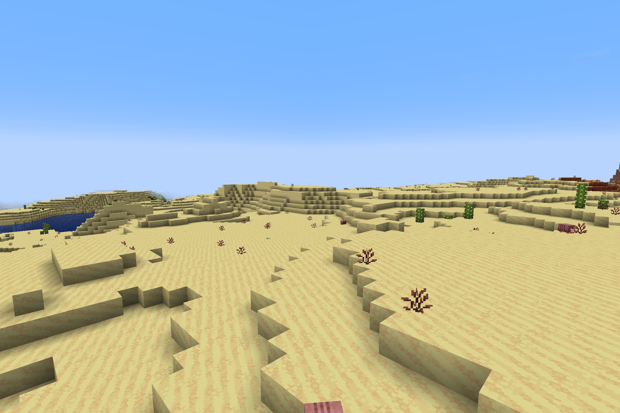 A vast desert landscape with stylized sand dunes in quadral pack