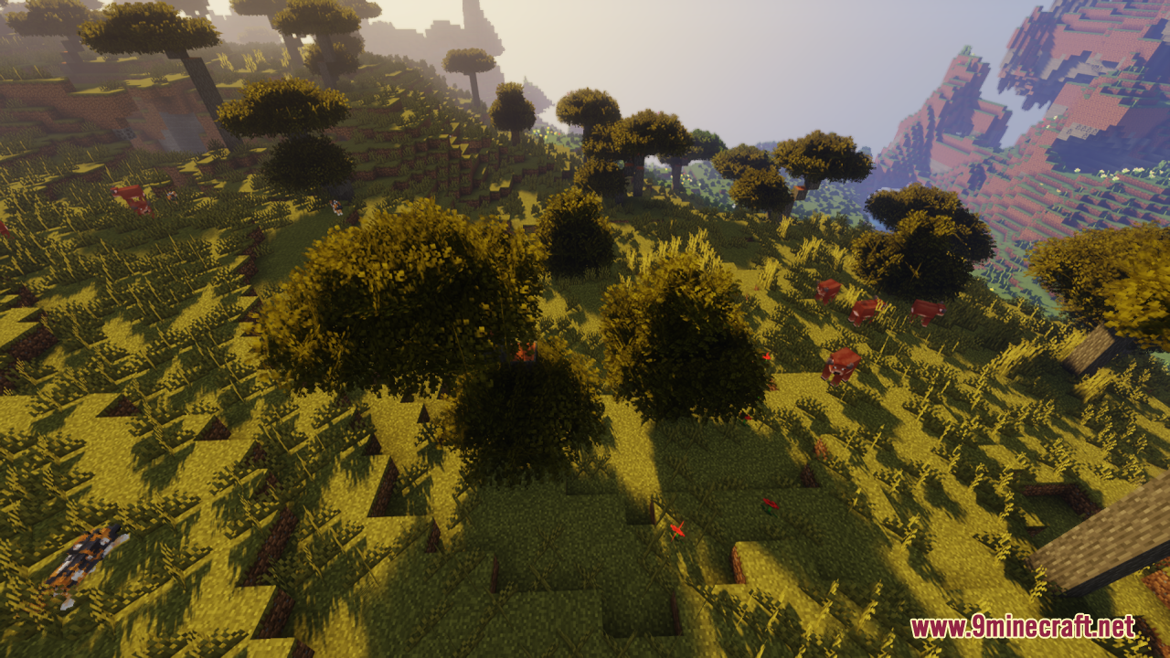 Rainbow’s Foliage Resource Pack (26.2, 1.20.1) – Bushier Leaves For Natural Forests 11 Red cows grazing near bushy trees in a sunny savanna biome