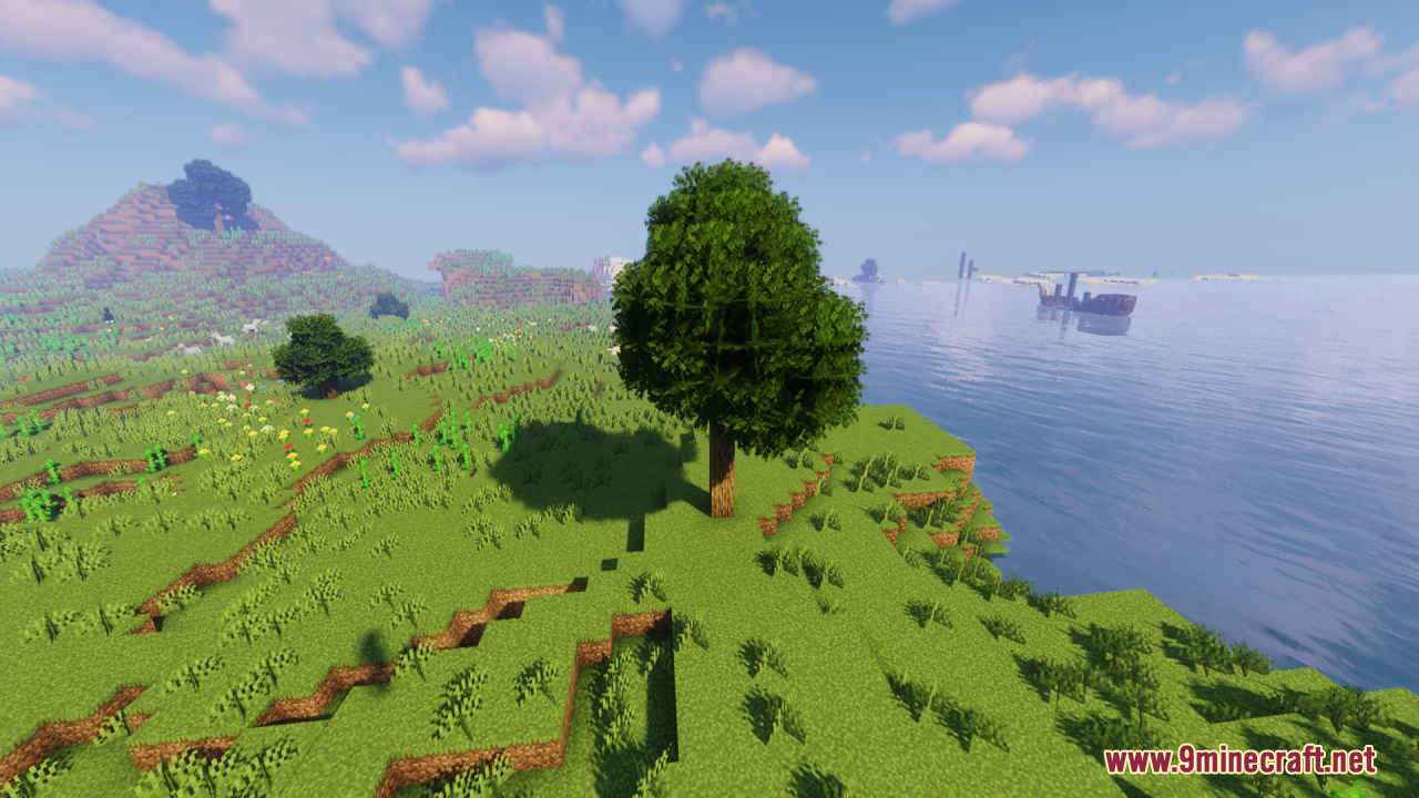 Rainbow’s Foliage Resource Pack (26.2, 1.20.1) – Bushier Leaves For Natural Forests 6 A bushy tree stands on a grassy cliff overlooking the vast blue ocean