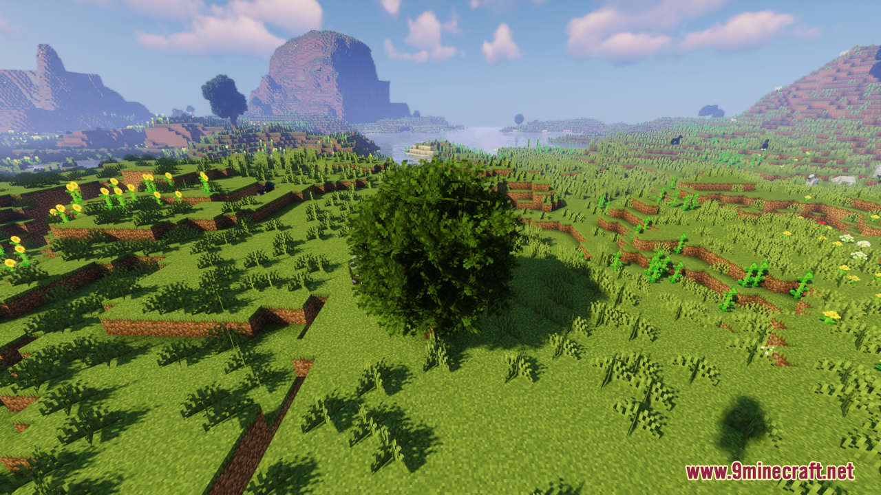 Rainbow’s Foliage Resource Pack (26.2, 1.20.1) – Bushier Leaves For Natural Forests 7 A bushy tree grows in a vibrant meadow filled with yellow sunflowers