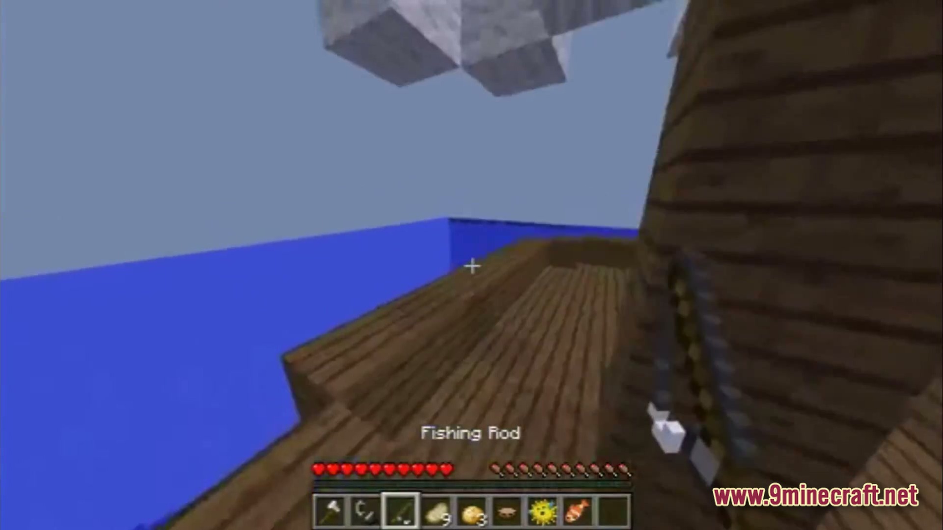 Saltwater Chronicles Modpack (1.21.1) – Explore Oceans And Defeat Monsters 3 A player stands on a wooden ship deck holding a fishing rod over the open ocean