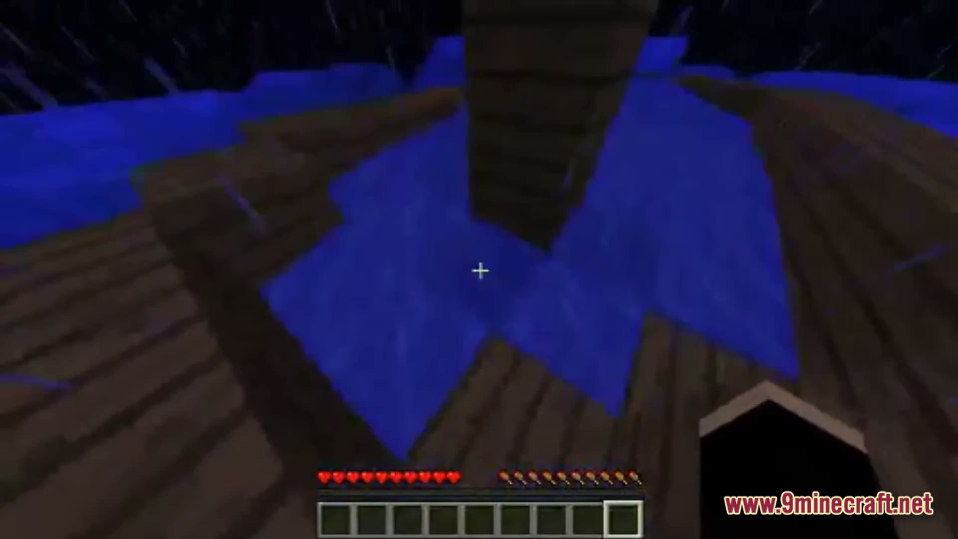 Saltwater Chronicles Modpack (1.21.1) – Explore Oceans And Defeat Monsters 7 A first-person view of a wooden boat structure floating on water during a rainstorm at night