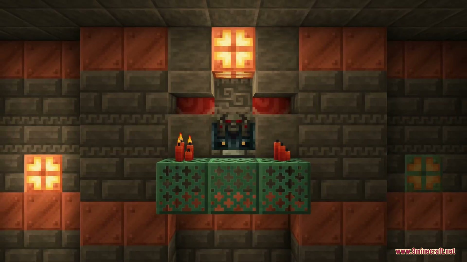 A trial spawner decorated with copper blocks and lit by red candles