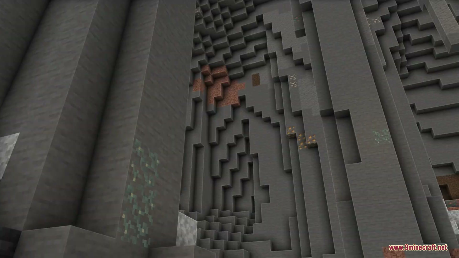 Natural stone cave walls displaying various mineral ores with soft lighting and colors