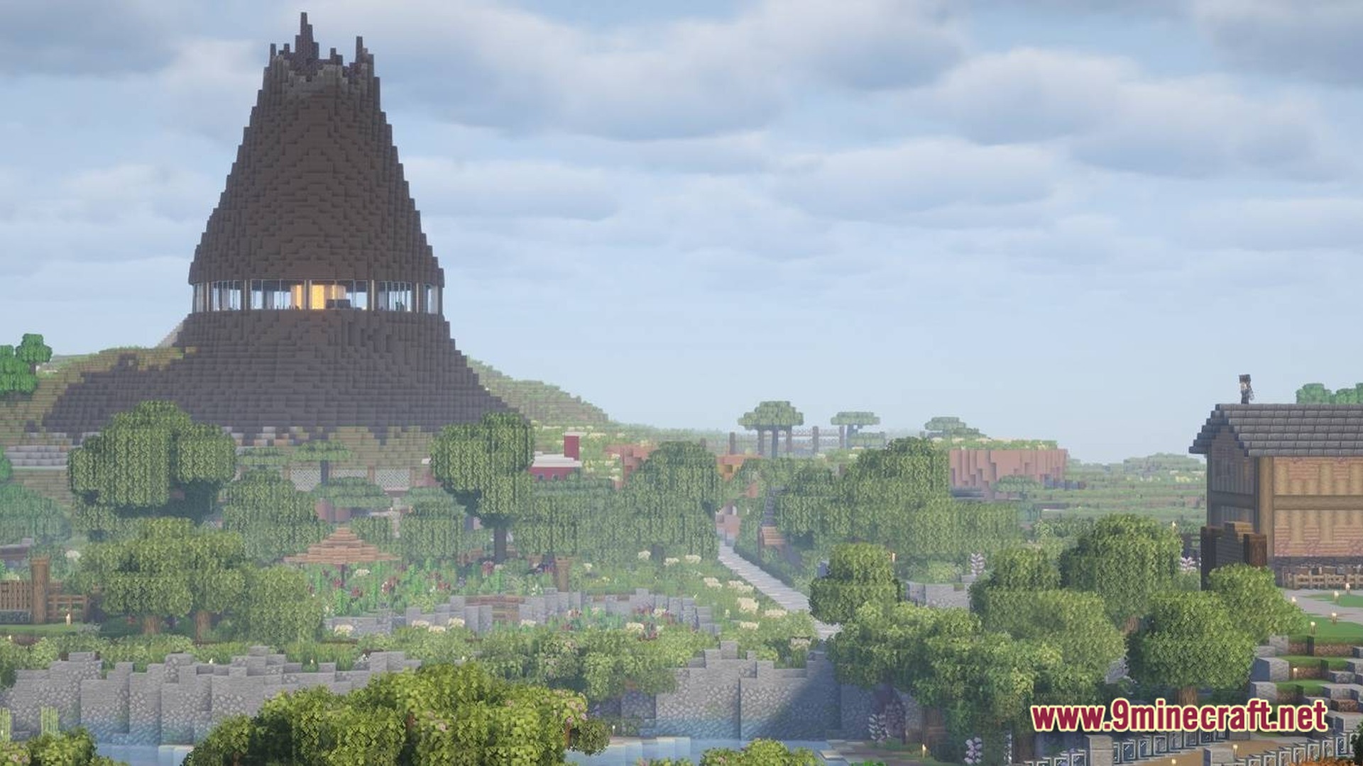 A large dark conical structure with a glass observation deck overlooks a lush park landscape