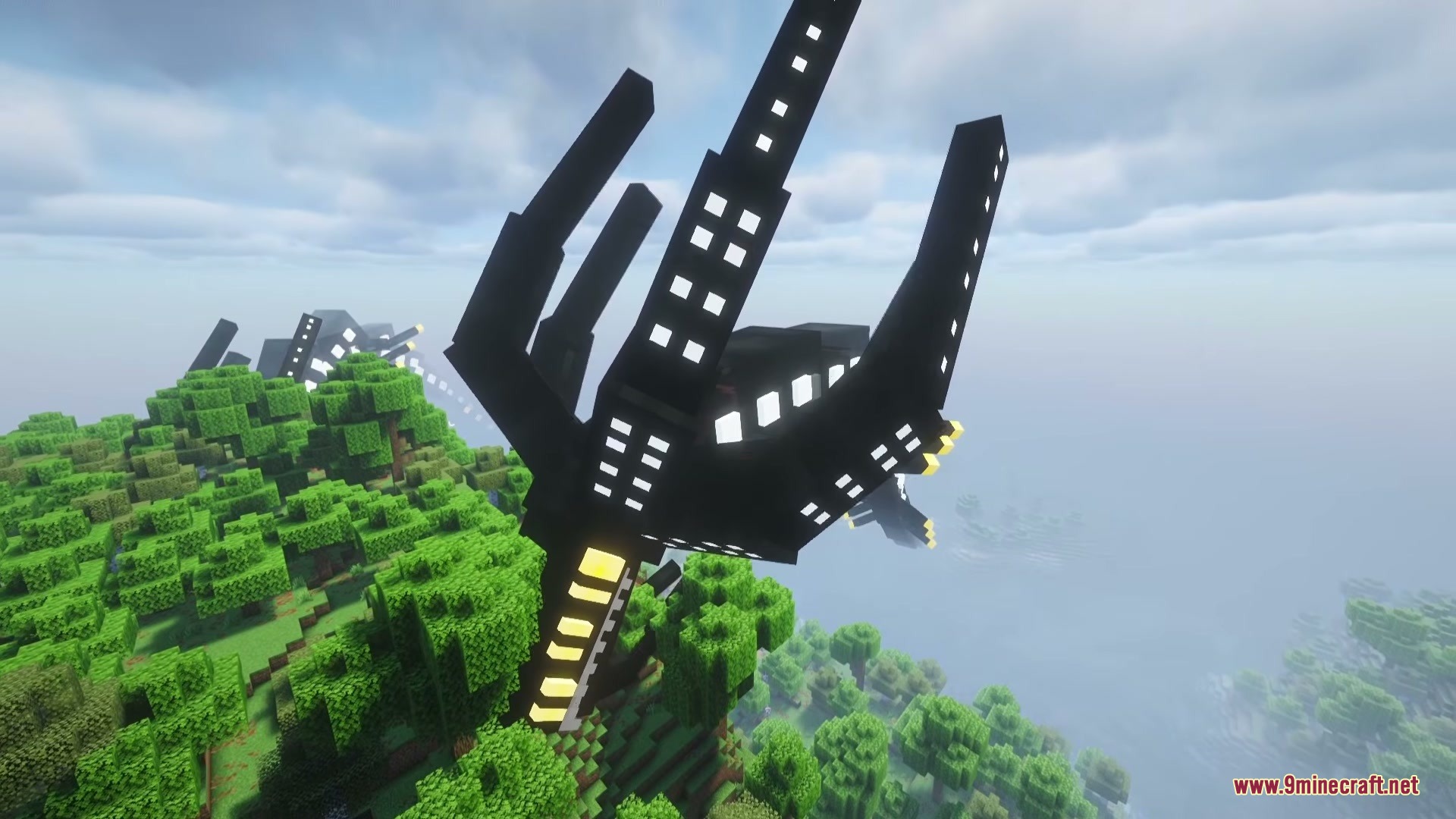 A massive black rocket structure stands tall within a lush green forest biome