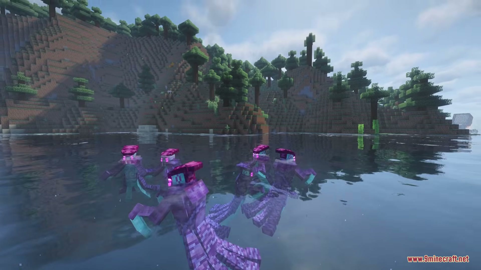 A group of purple alien creatures swimming in a lake near the shore