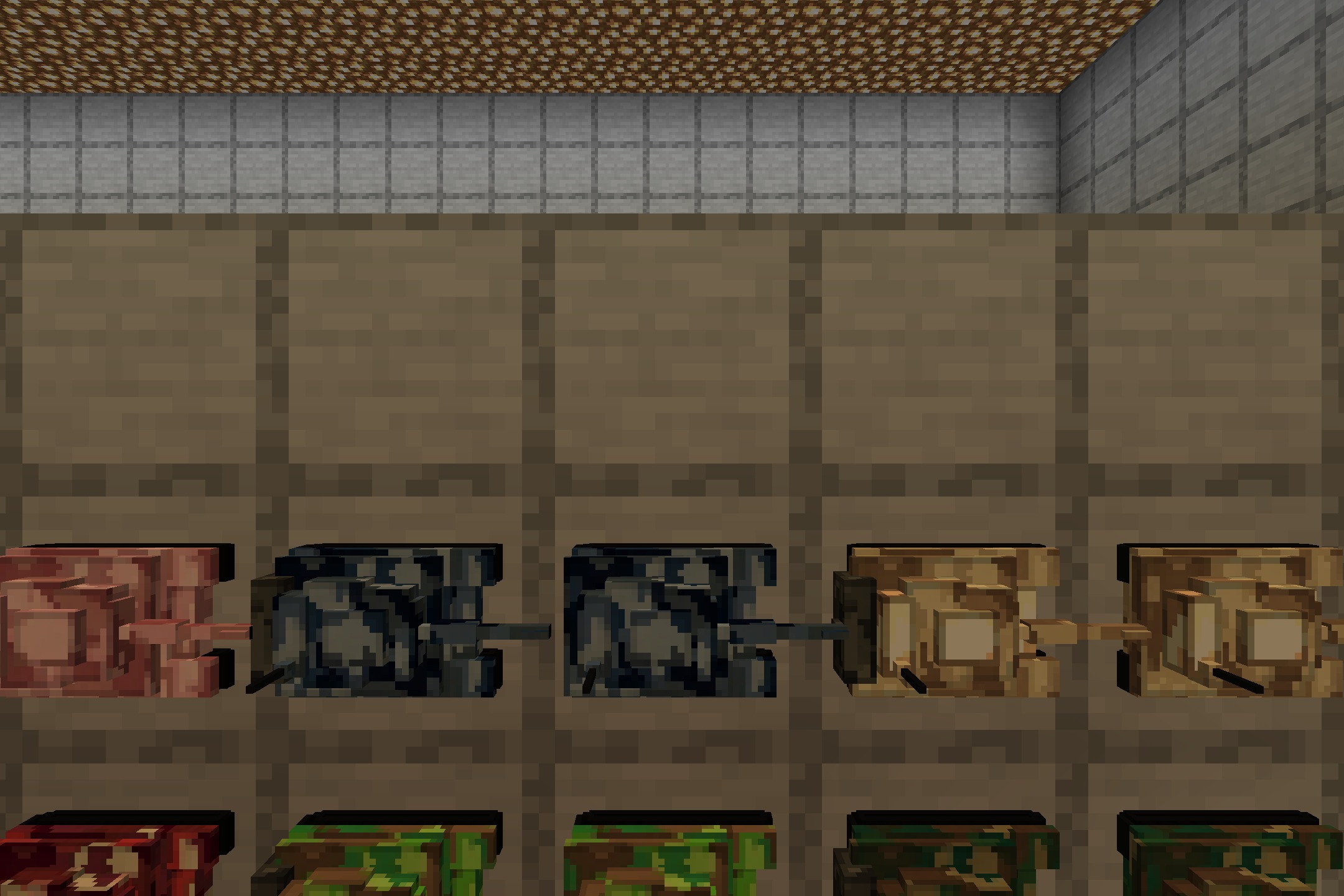 Close up view of camouflage tank models mounted in item frames