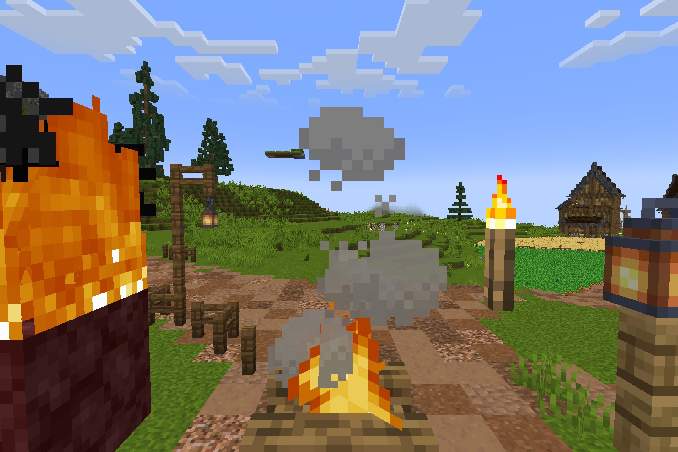 Campfires and lanterns light up a path in a vibrant minecraft village scene