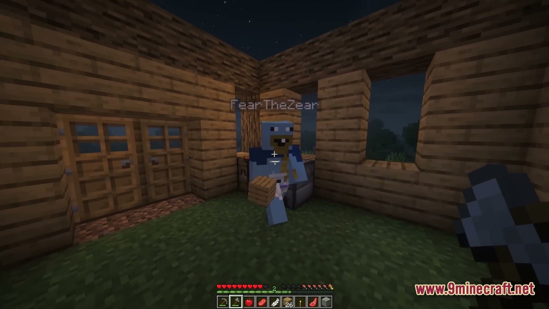 The Stalker Recreation Modpack (1.20.1) – Survive Craft Guns Hunt Monsters 3 A player character stands inside a wooden structure at night holding a block of wood