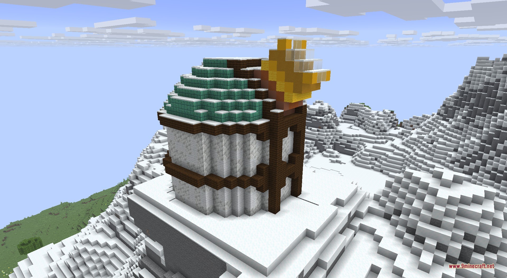 A detailed observatory structure built on top of a snowy mountain peak