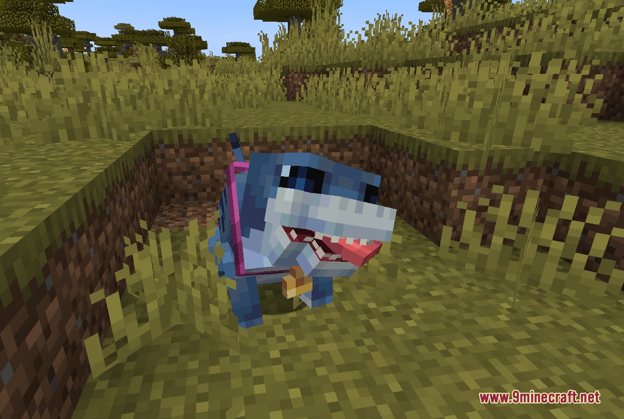 Tidal Crawler Companion Mod (1.20.1) – Raise And Train A Loyal Landshark 2 Jeff the landshark sits in a dirt pit wearing a pink harness