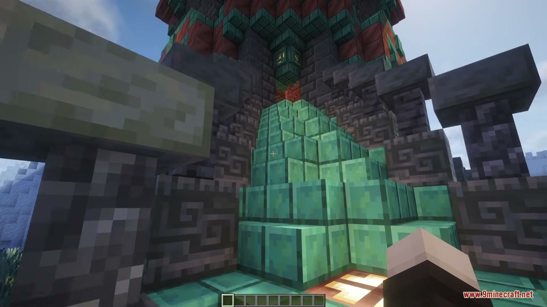 Detailed view of oxidized copper blocks and deepslate walls at the base