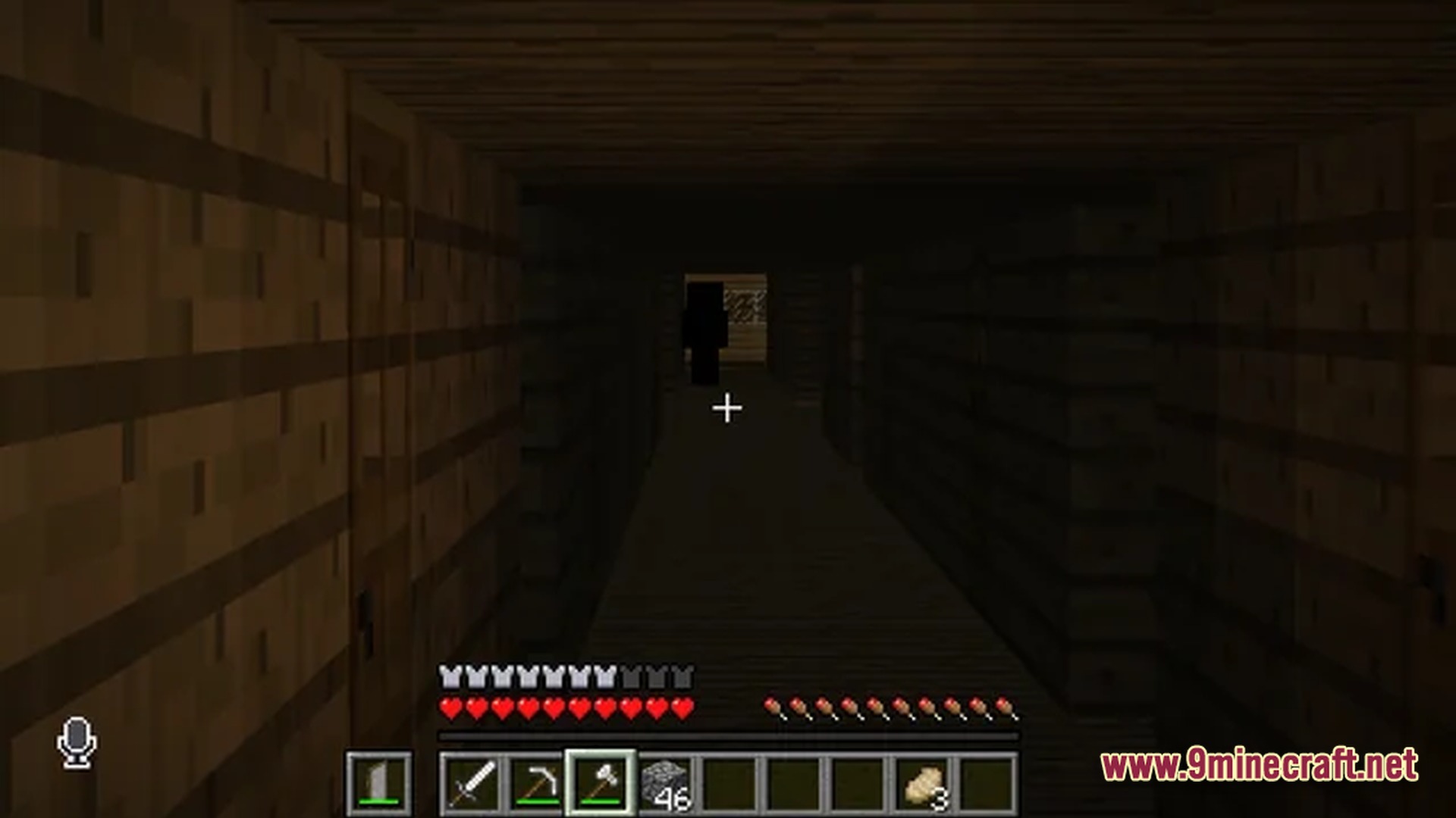 A dark wooden hallway featuring a shadowy humanoid figure standing at the far end