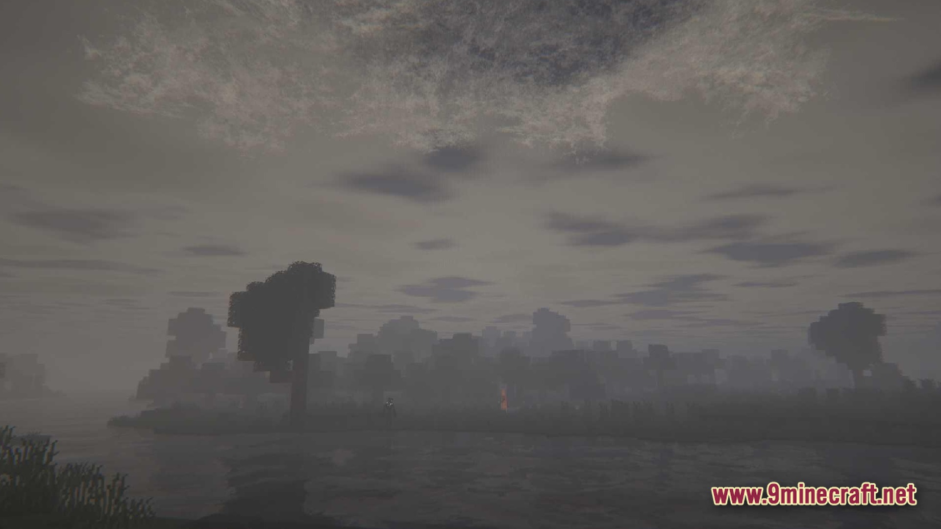 True Horror Modpack (1.20.1) – Survive Terrifying Monsters 11 A dark, foggy minecraft landscape featuring a distant forest, a body of water, and overcast skies