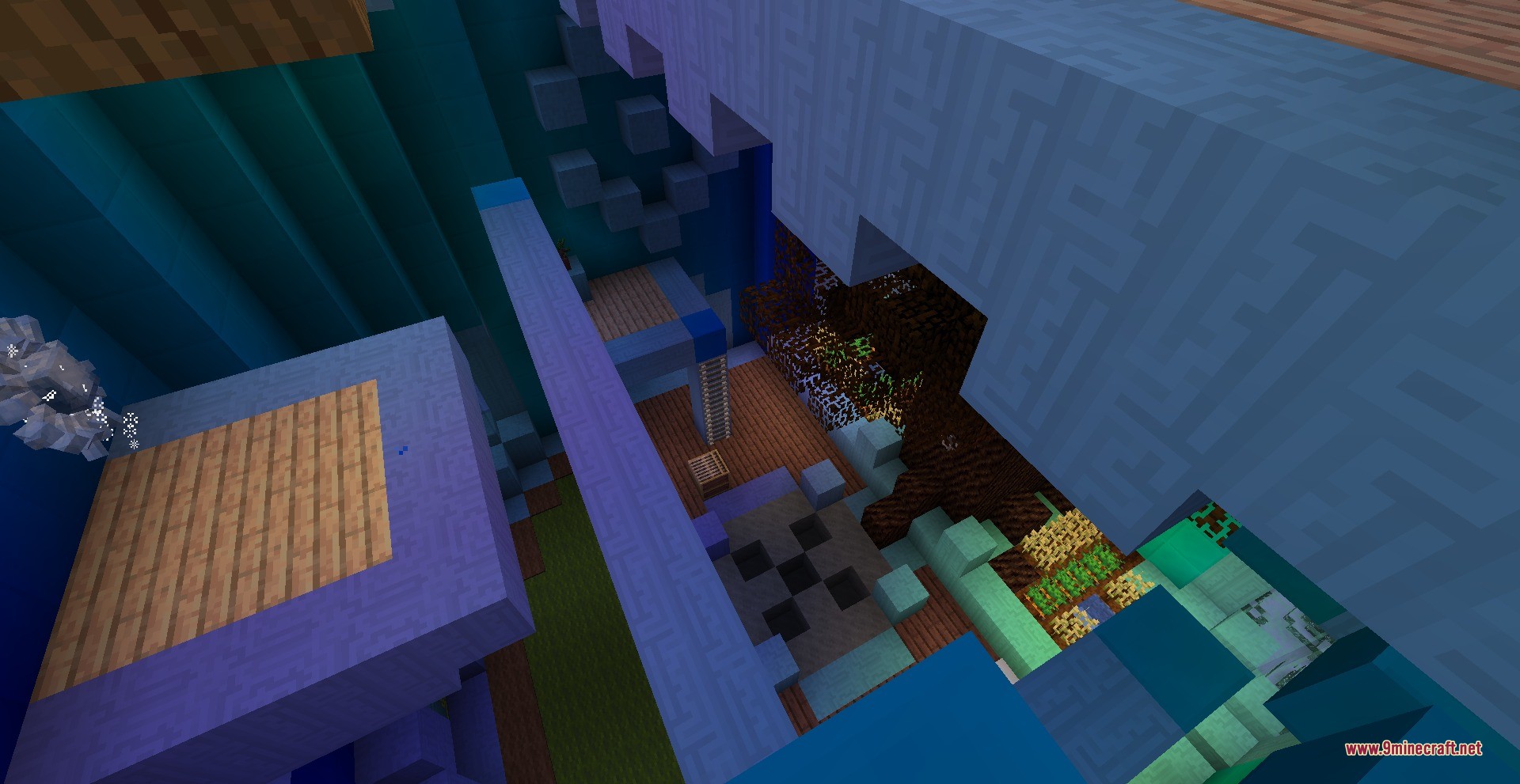 An overhead view of a room featuring wooden floors and indoor farm areas