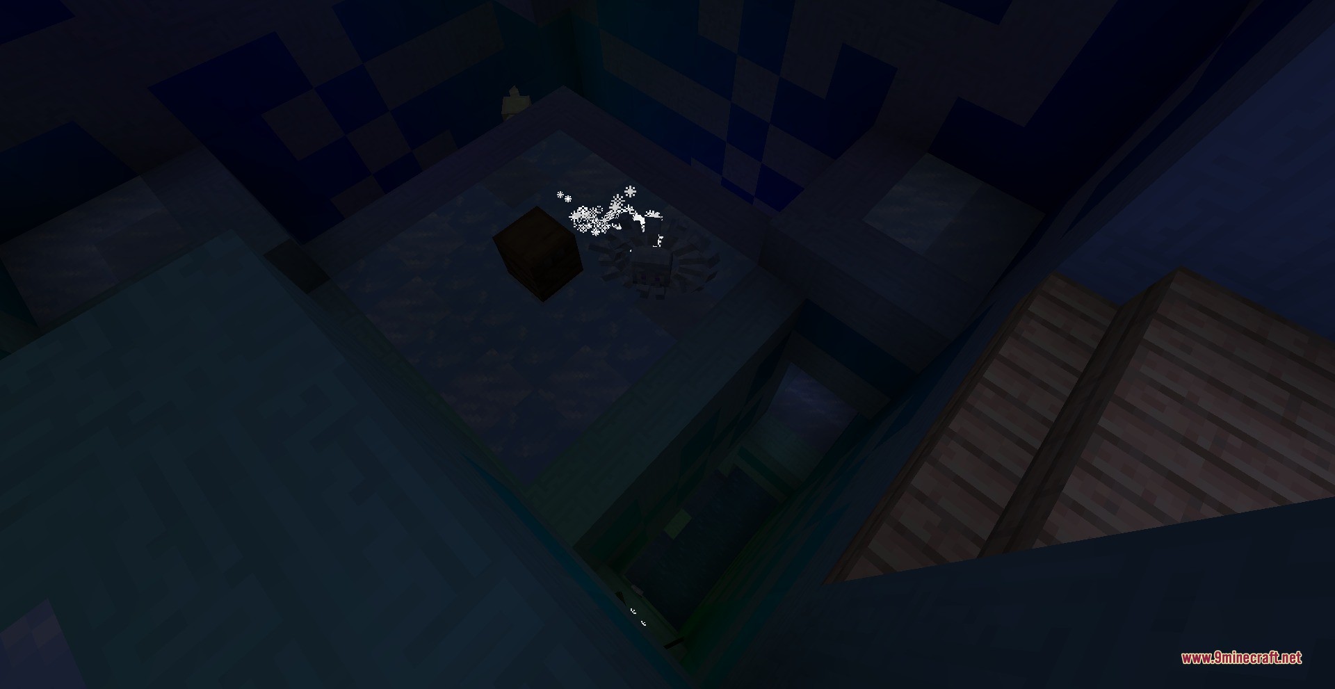 A dark tower room with a brown block and snowflake particles near a pit