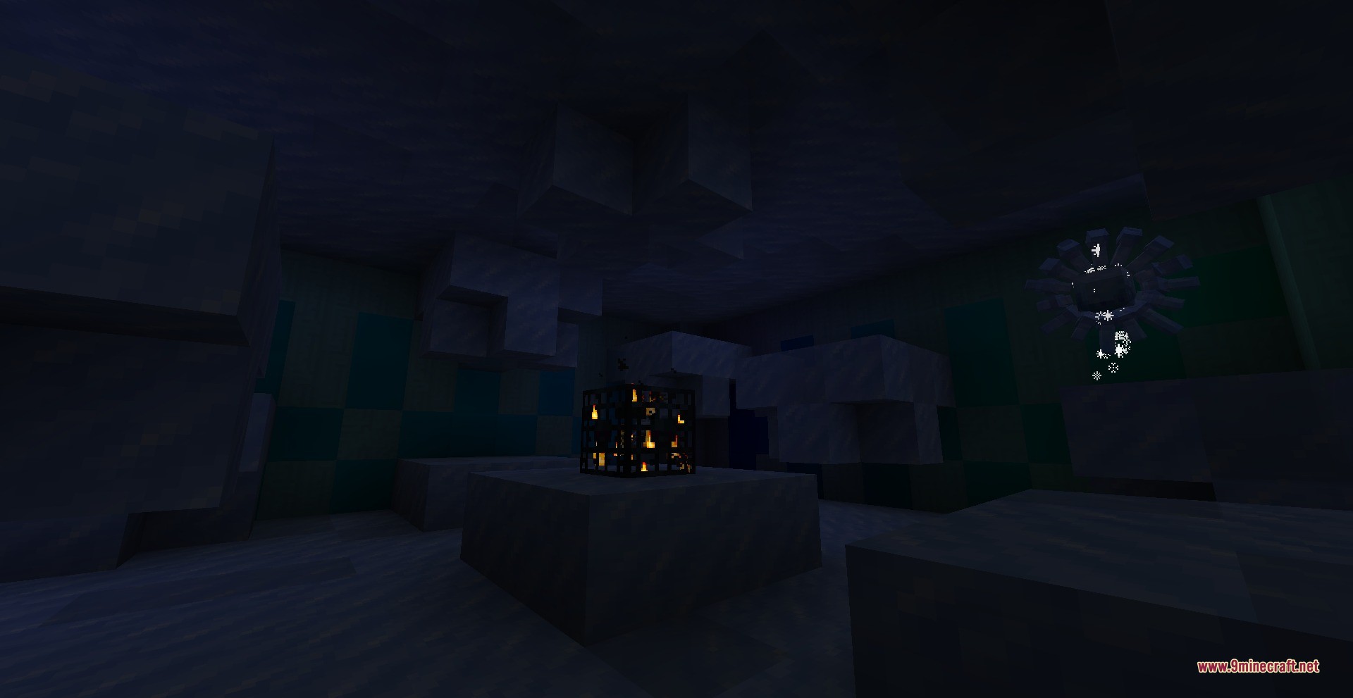 A glowing monster spawner sits inside a dark room made of ice blocks