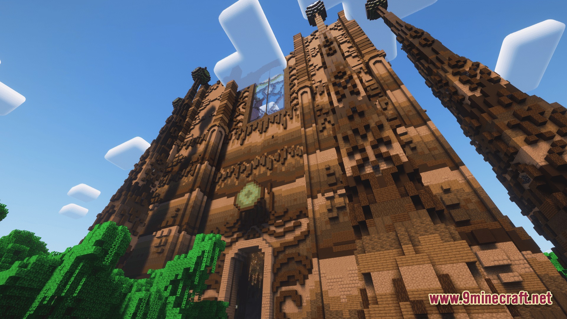A massive, ornate wooden cathedral structure featuring intricate block detailing and towering spires under a blue sky