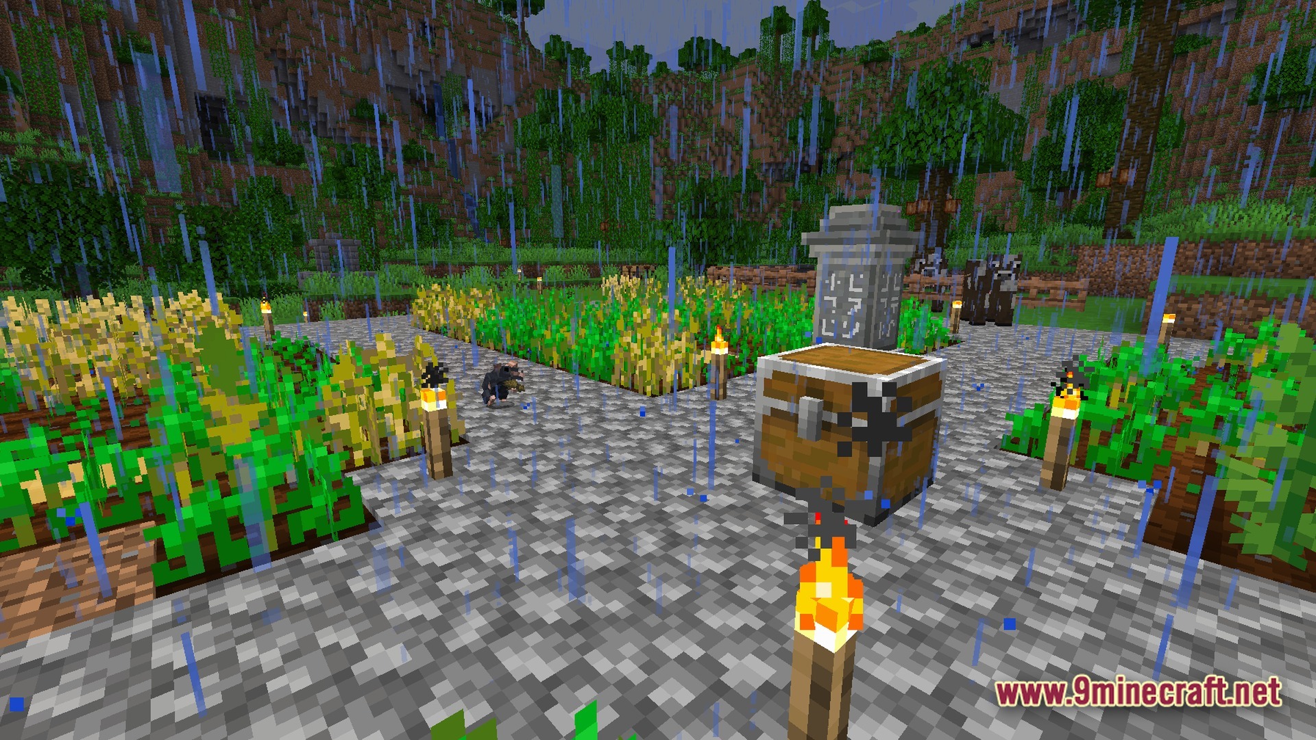 A rat harvests crops in a rainy jungle farm featuring a stone waystone and storage chest