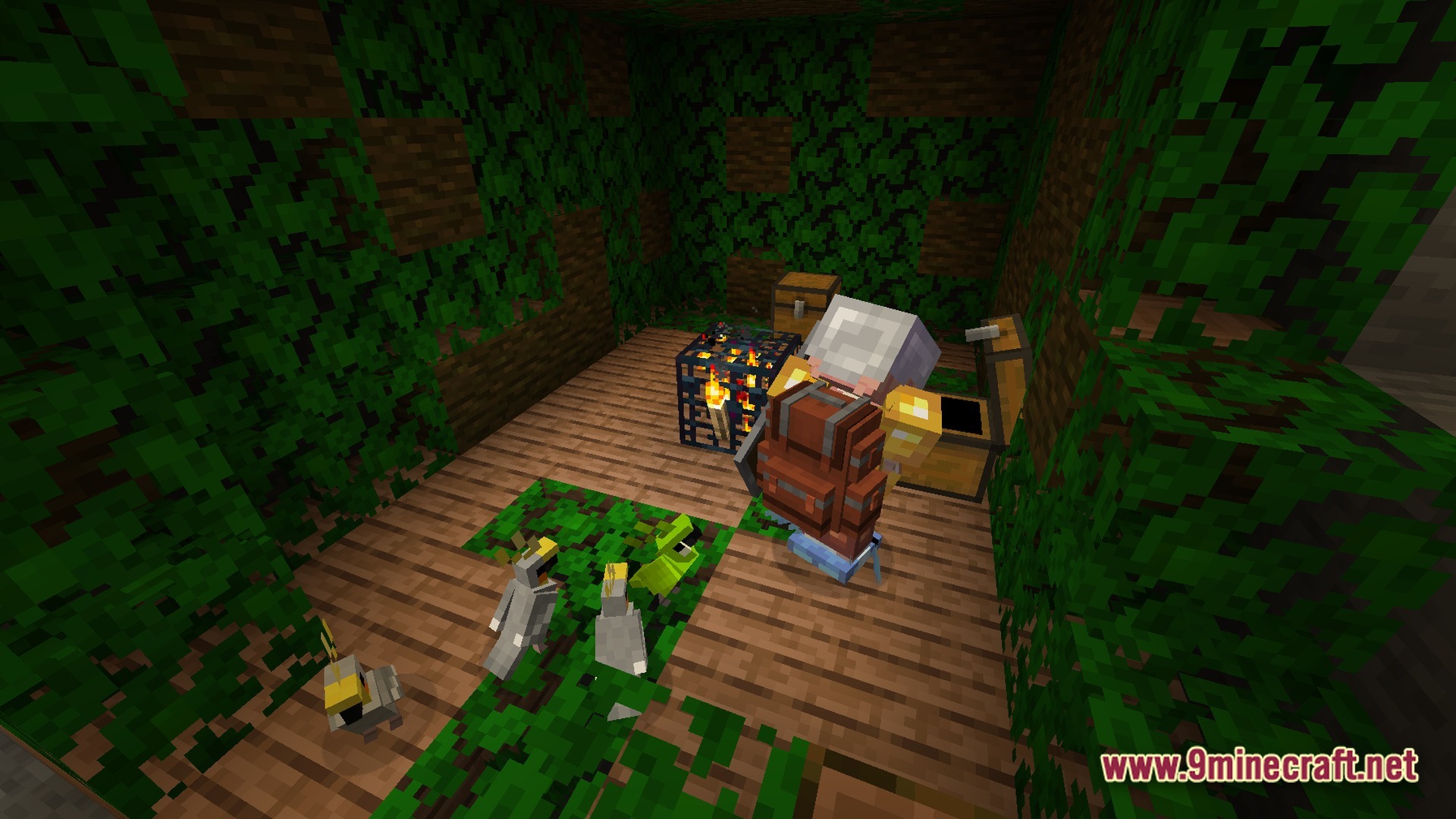 A player with a backpack explores a jungle-themed dungeon room containing parrots and a monster spawner