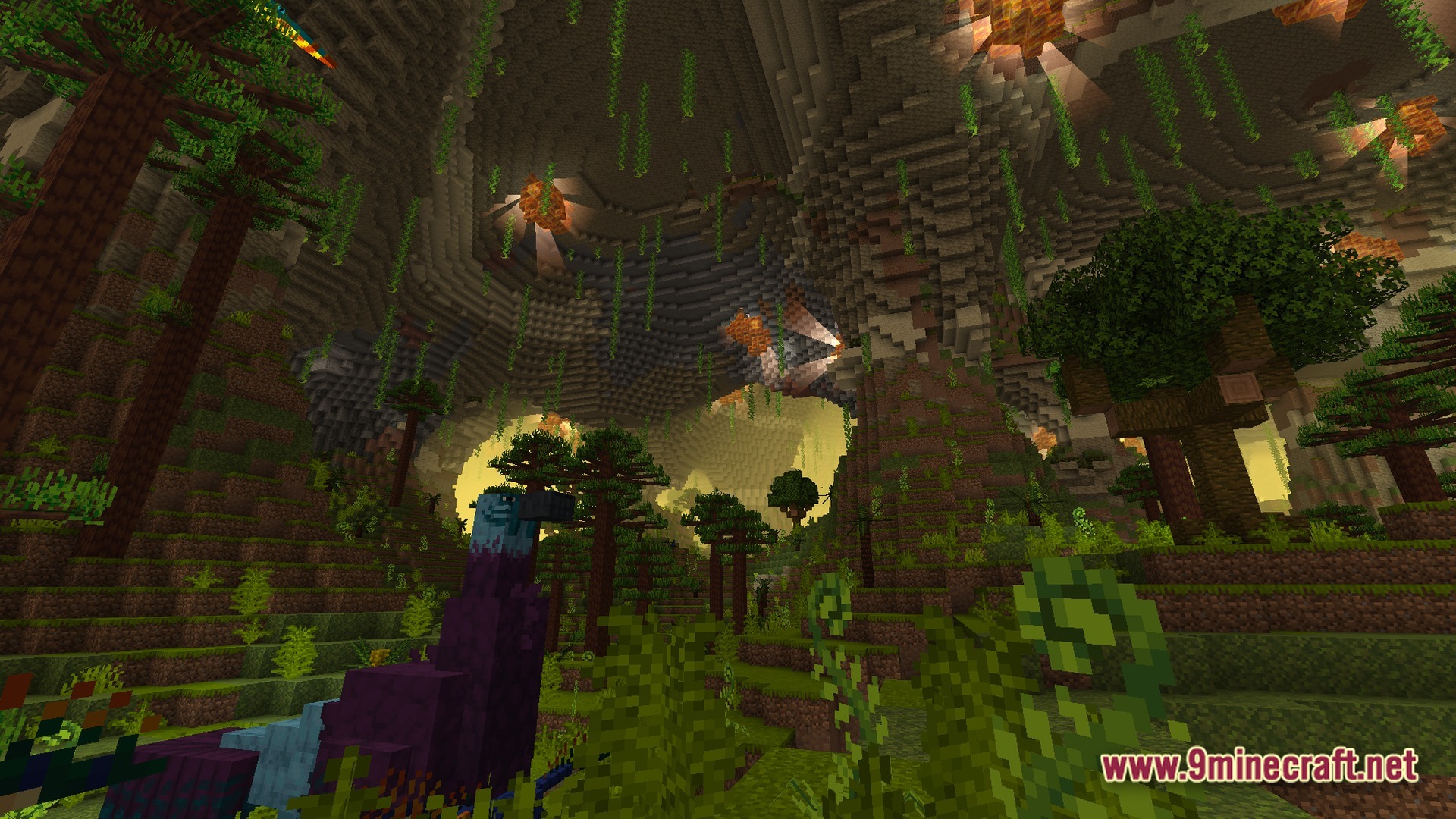 A large underground cavern featuring a lush jungle biome with trees, vines, and custom bird mobs