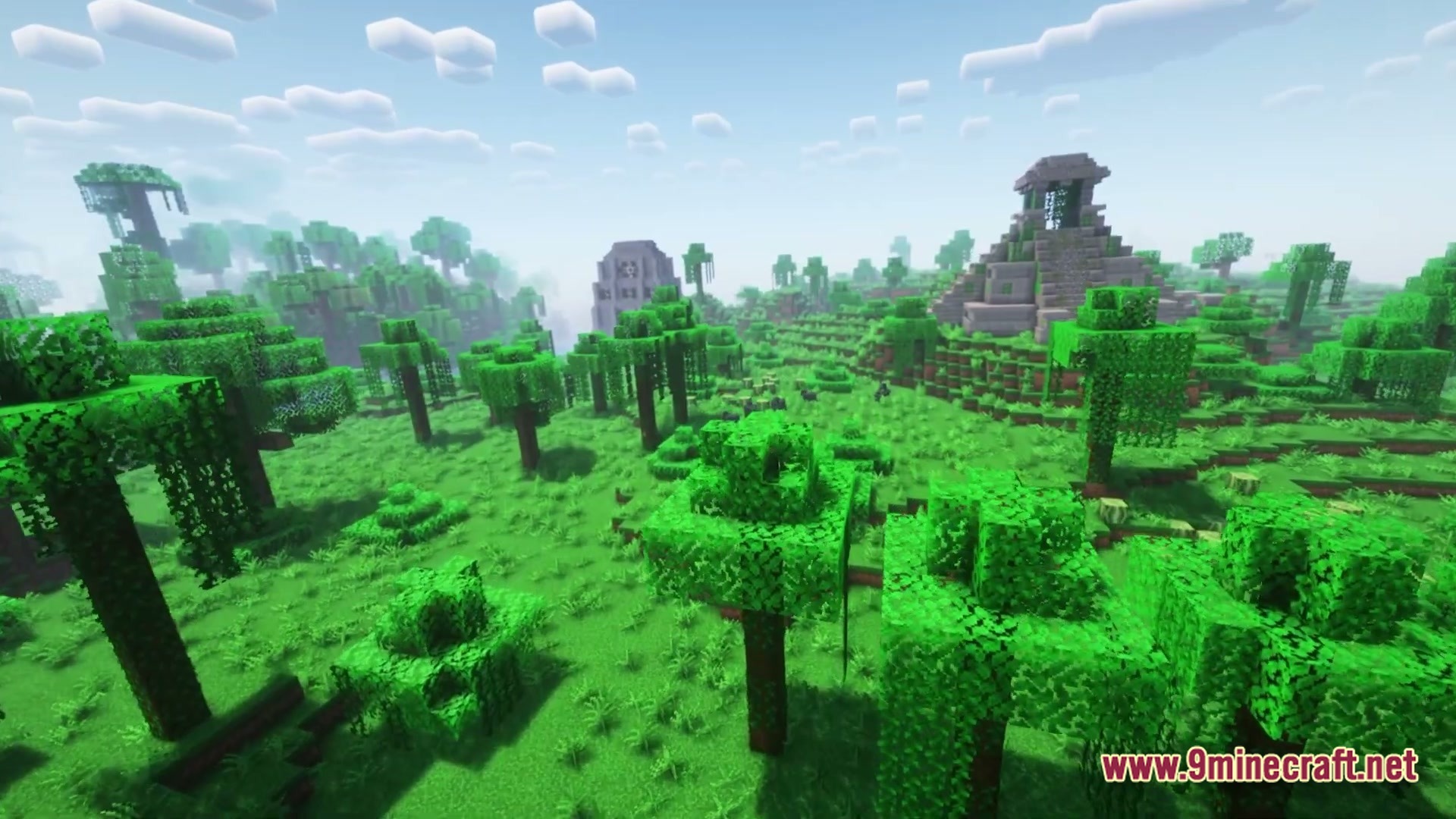 Stone temples and structures stand within a lush jungle biome under a bright, cloudy sky