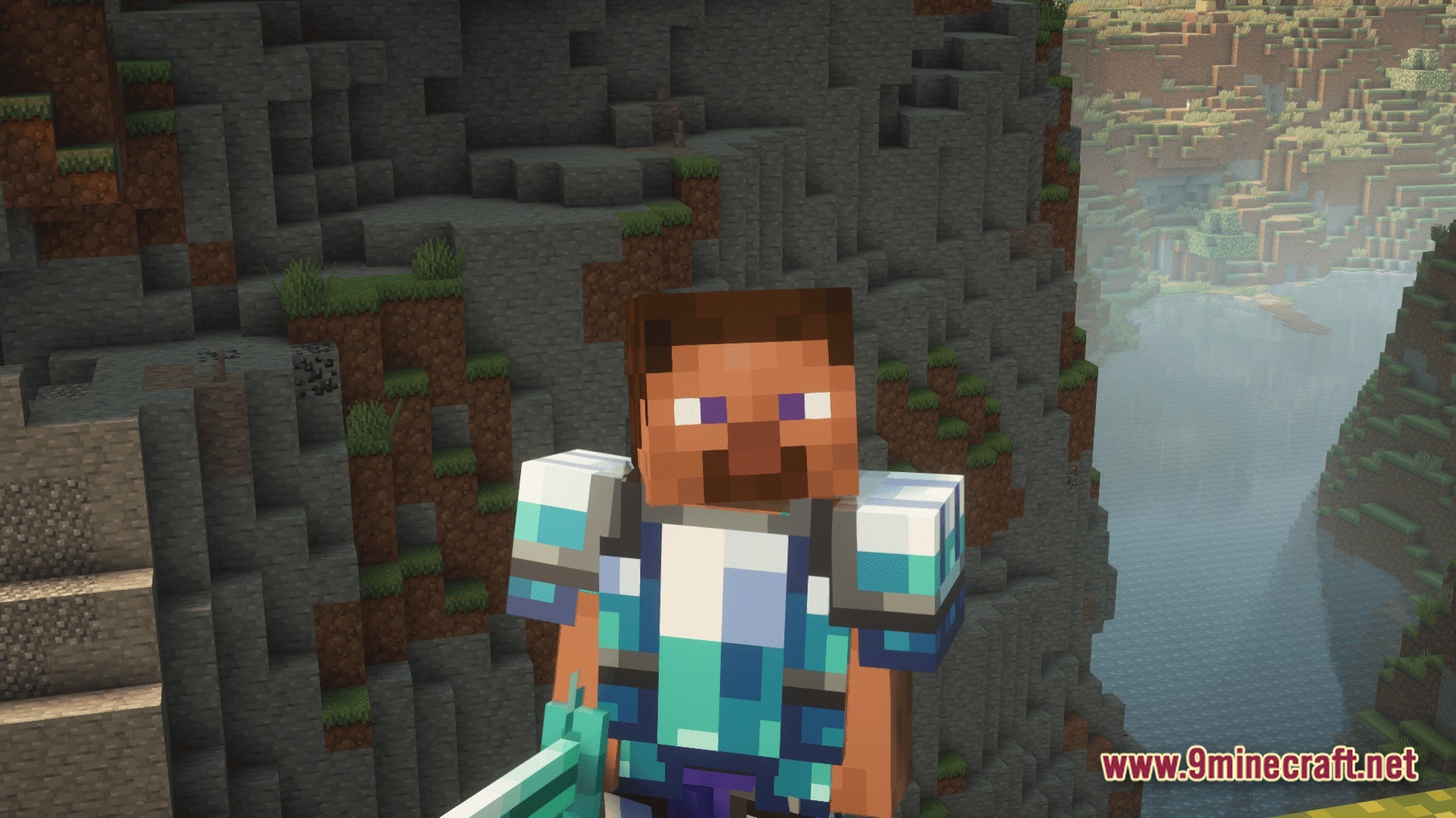 A player character wearing blue patterned armor stands before a steep mountain cliff and a river