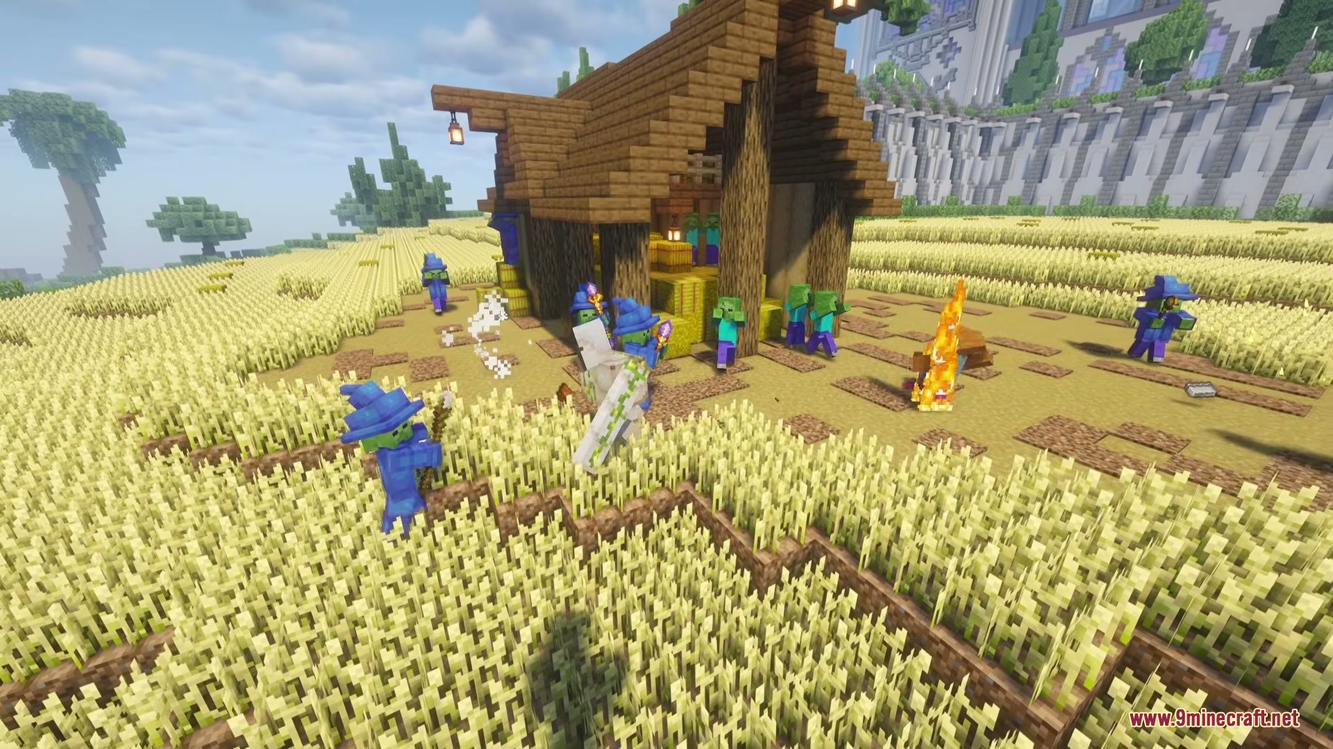 Wizard Mobs Mod (1.21.1) – Survive Magic Attacks From Spellcasting Undead 7 Wizard zombies wearing blue robes and hats gathered around a wooden house