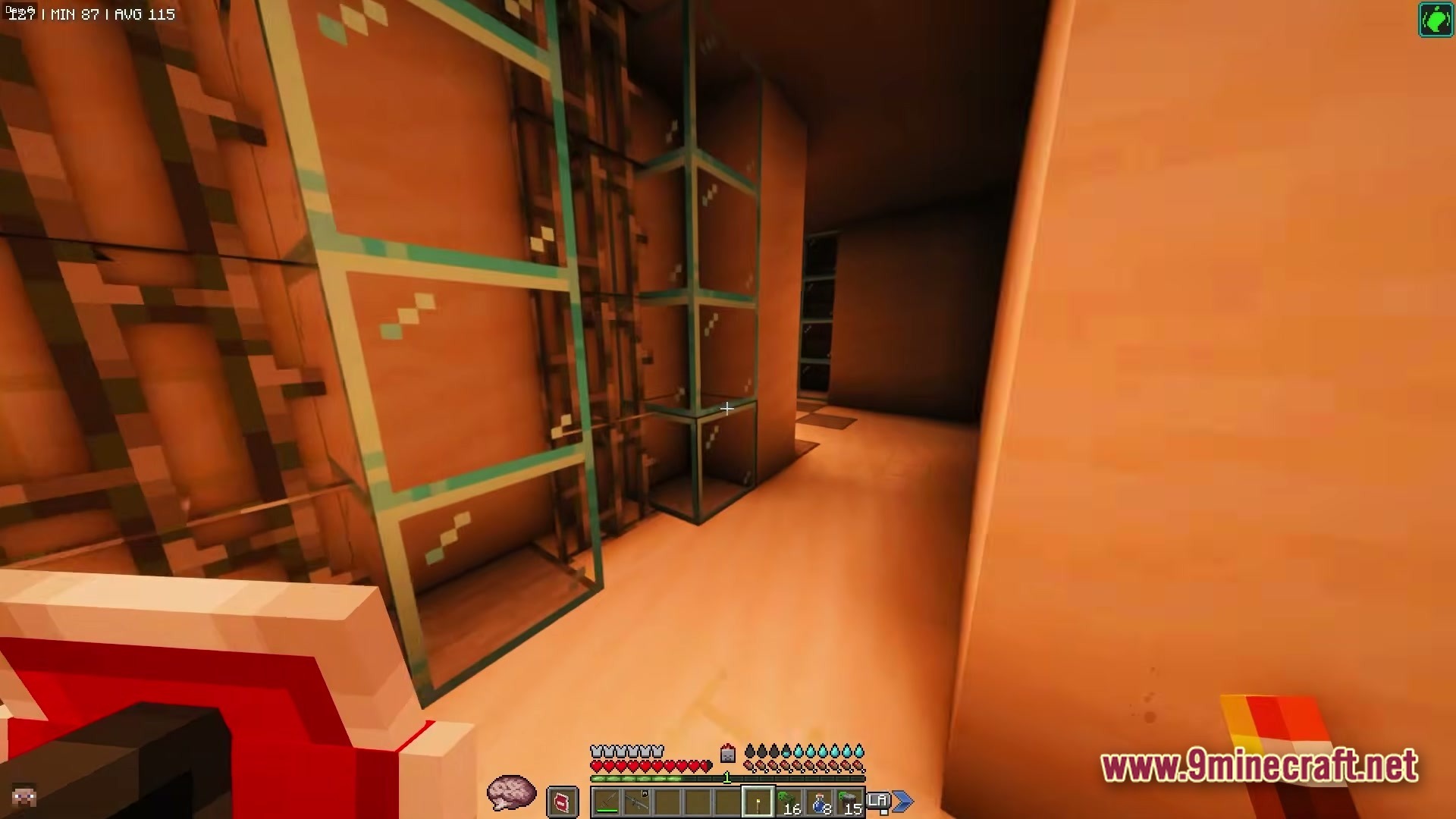 Zombiemania A Modern Zombie Apocalypse Modpack (1.20.1) – Survive The Ultimate Undead Wasteland 2 A player explores a dimly lit interior hallway featuring glass blocks and industrial metal scaffolding