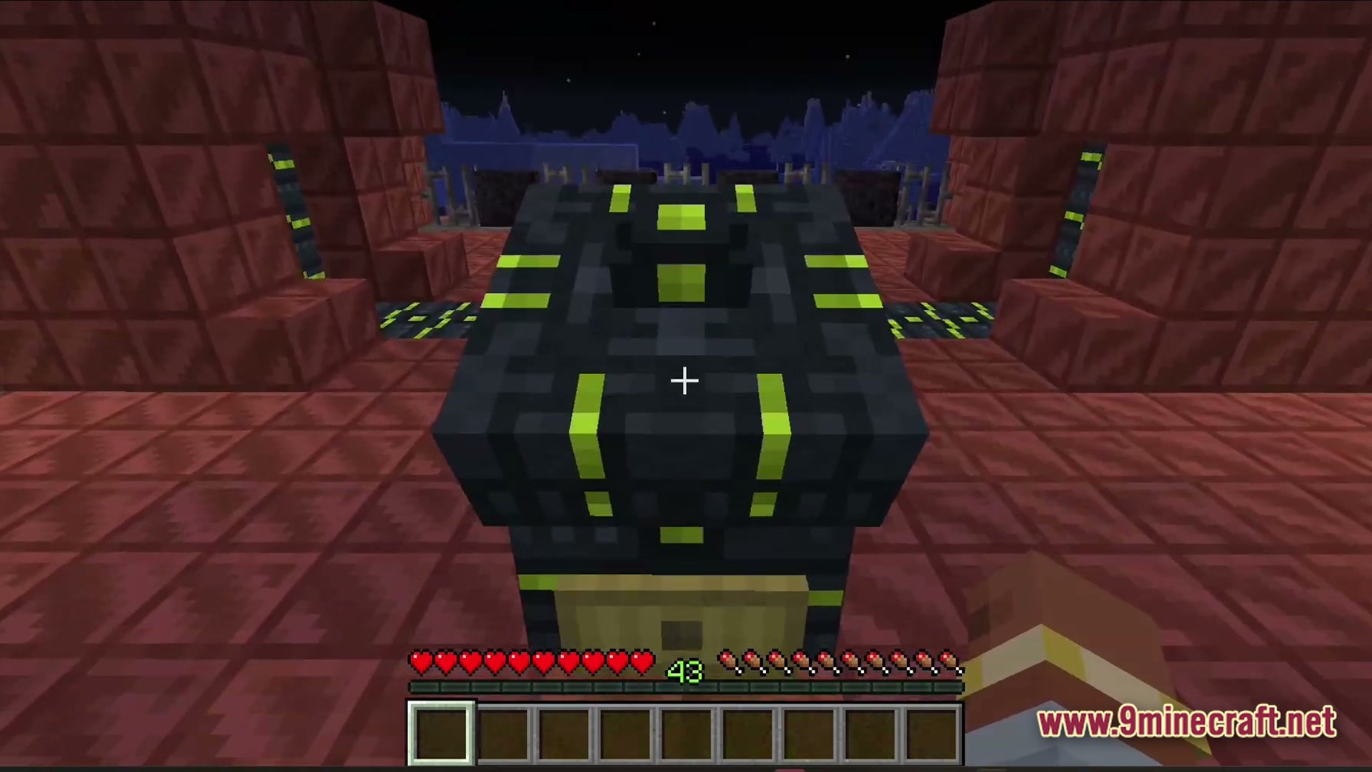 A first-person view of a dark industrial machine with lime green accents on red blocks