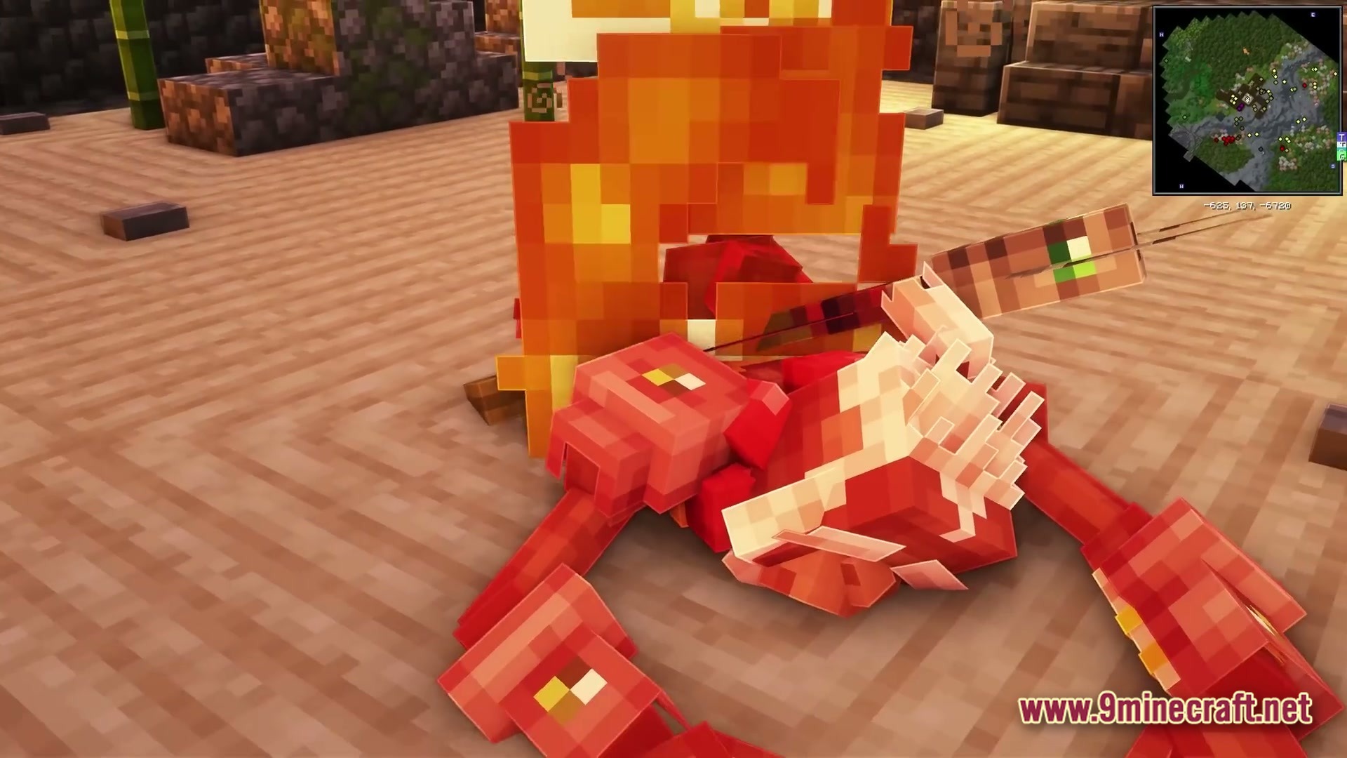 A red crab mob on fire with an arrow embedded in its shell on sand