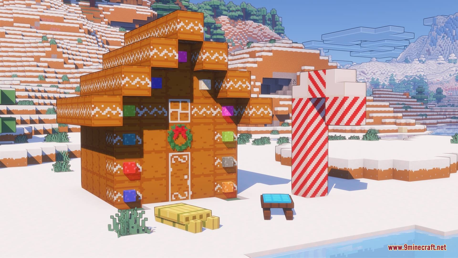 Gingerbread house and candy cane decoration in a snowy biome