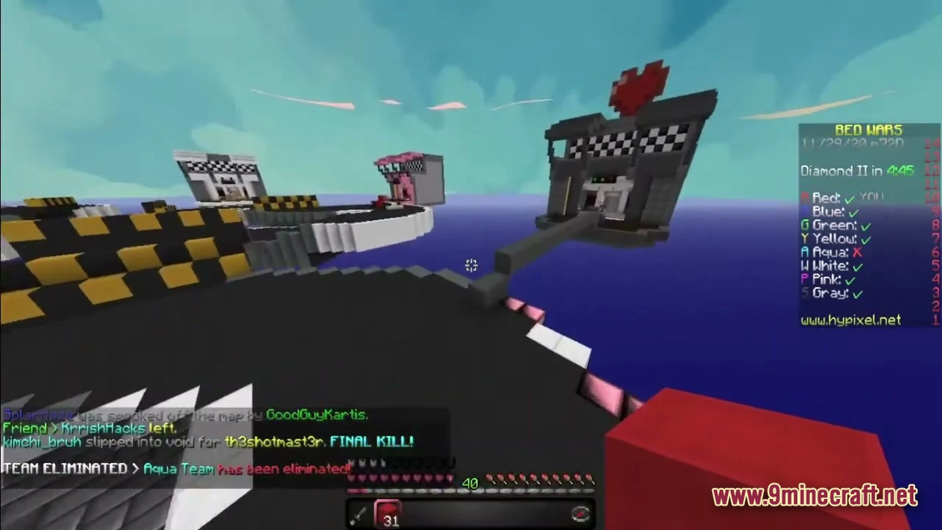 A bed wars match on the hypixel server featuring floating islands and a racing-themed map
