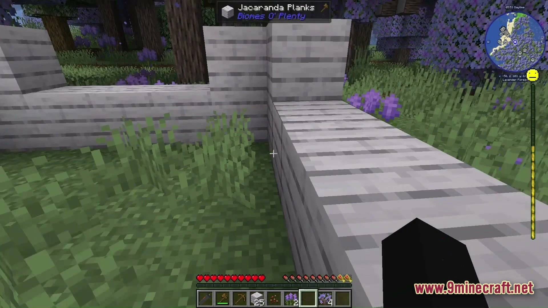 Grimsoul Unleashed Modpack (1.20.1) – Ai Survival Horror Adventure 4 A player builds a structure using jacaranda planks within a lavender forest biome