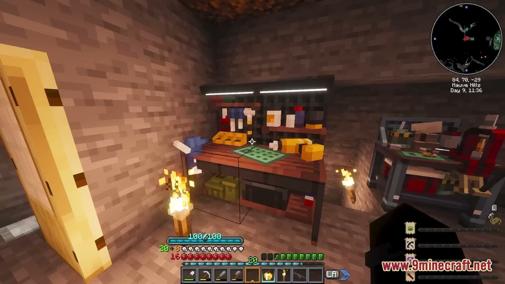 A detailed workbench station with tools and crafting supplies inside a stone underground base