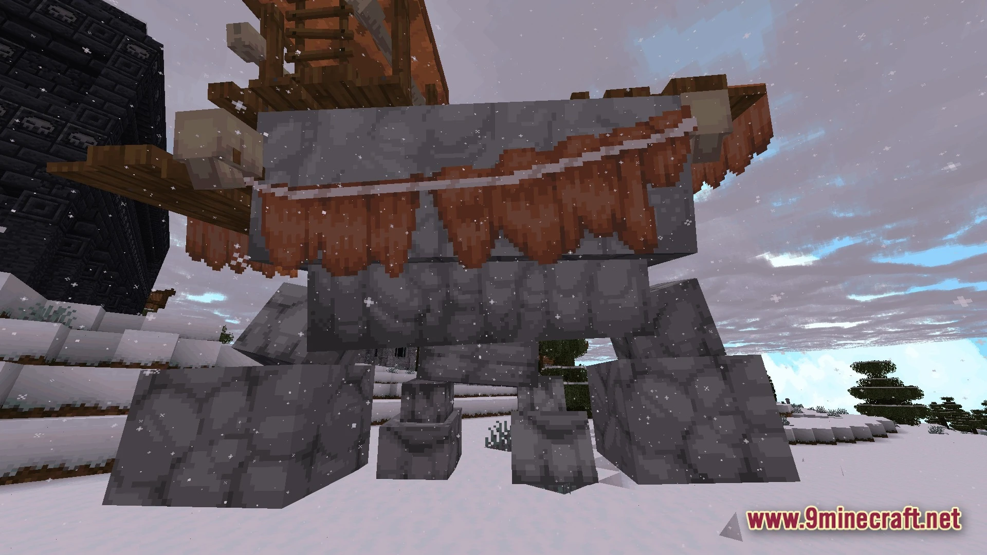 Mystic Realm Awakened Modpack (1.20.1) – Magic Mystery And Hard Survival 3 A large stone golem creature carrying a wooden structure stands in a snowy mountain biome
