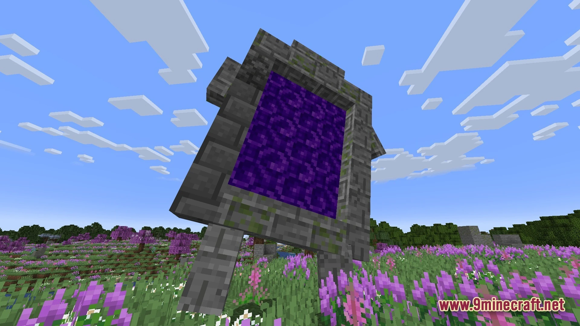 Mystic Realm Awakened Modpack (1.20.1) – Magic Mystery And Hard Survival 9 A large stone portal stands in a flowery meadow under a clear blue sky