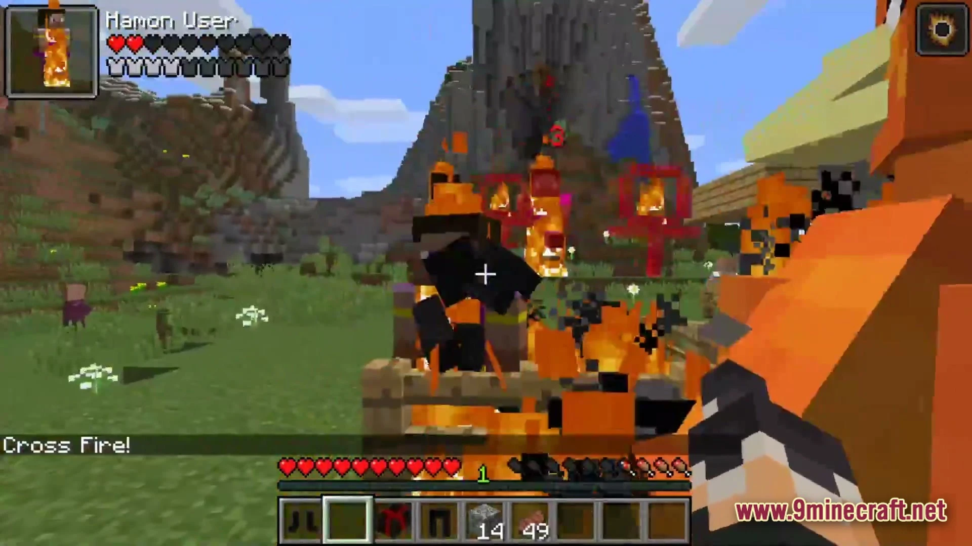A player uses a fire ability against mobs in a grassy plains biome with mountains