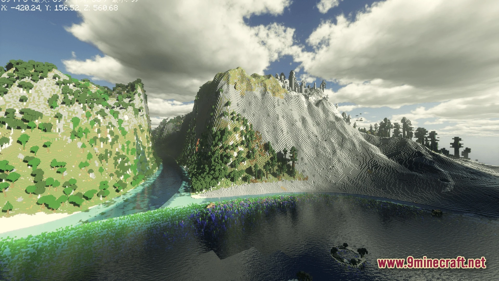 Large-scale custom mountain terrain featuring a river valley and forested slopes under a cloudy sky