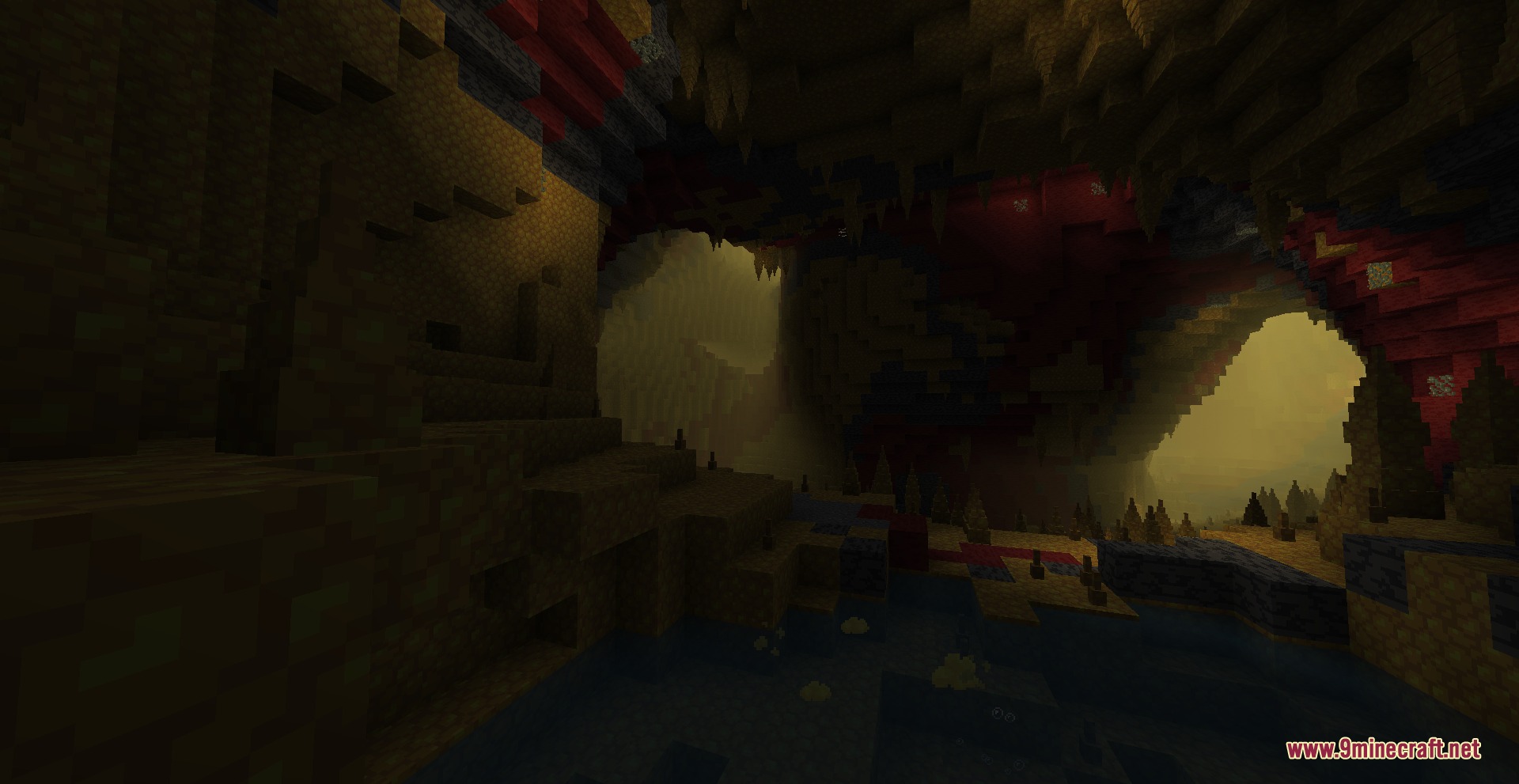 Dusty yellow mist fills a dark cavern with sharp stalactites and stalagmites