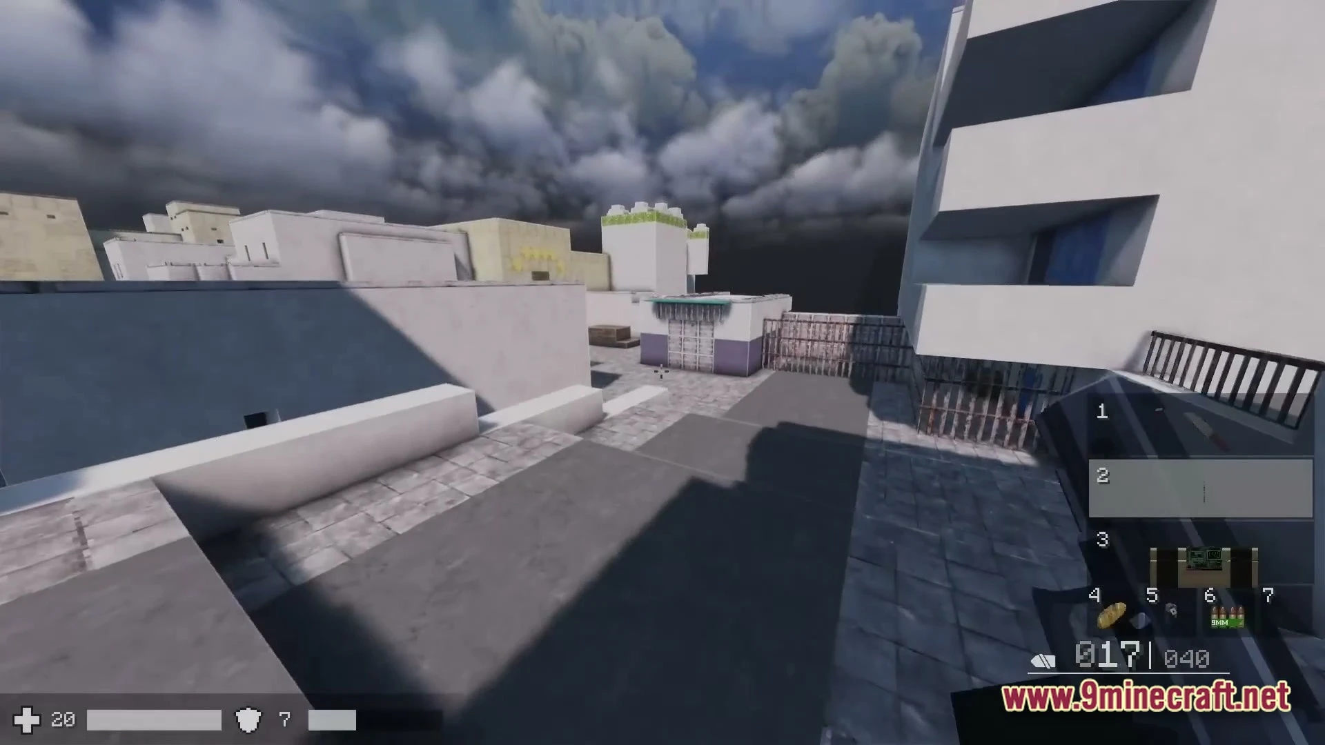 First-person perspective of a player holding a firearm in an urban environment with modern white buildings