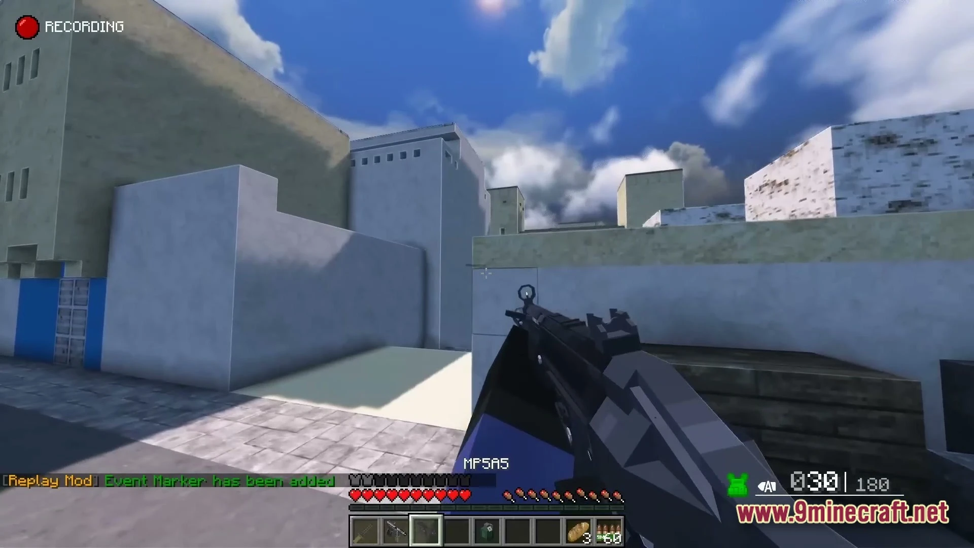 A first-person perspective of a player holding an mp5a5 submachine gun in an urban environment
