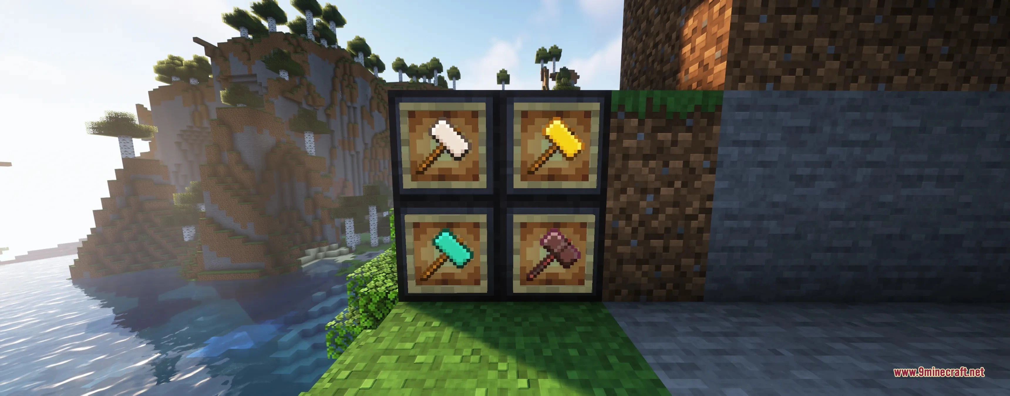 Four types of hammers in item frames against a scenic mountain background
