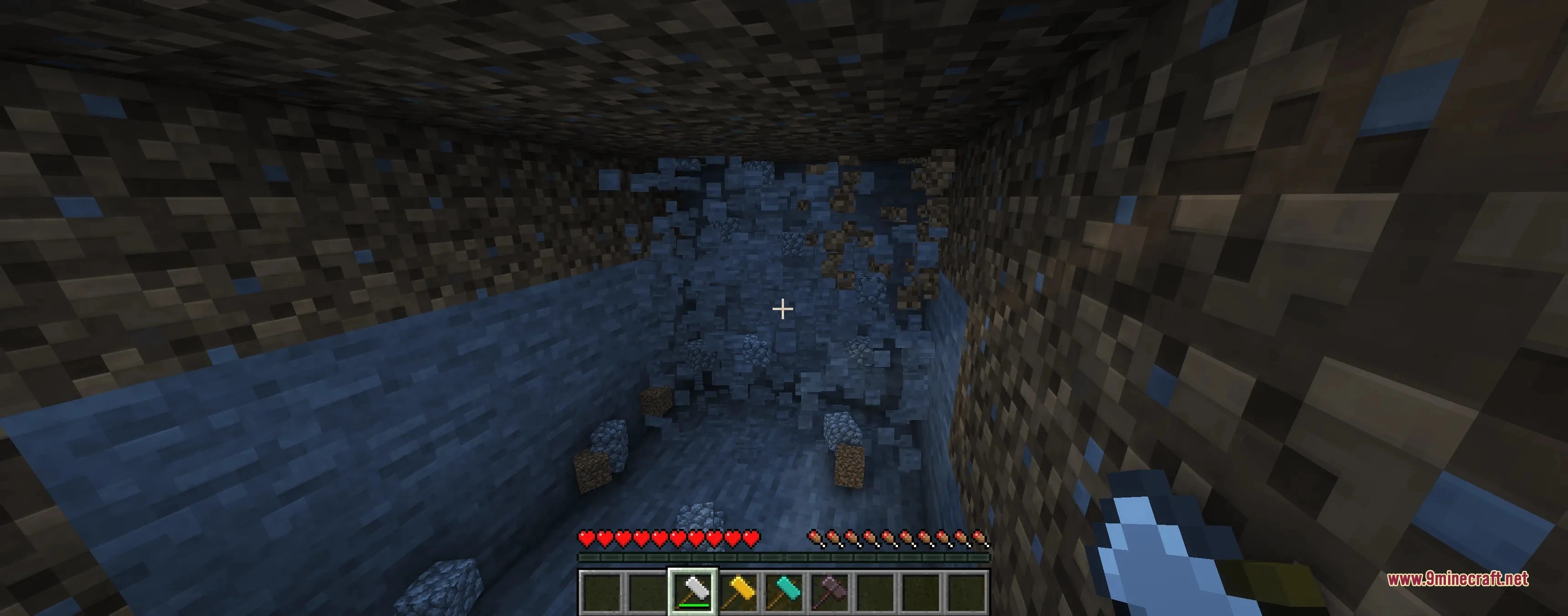 Player using a tectonic widebore hammer to clear a large tunnel area