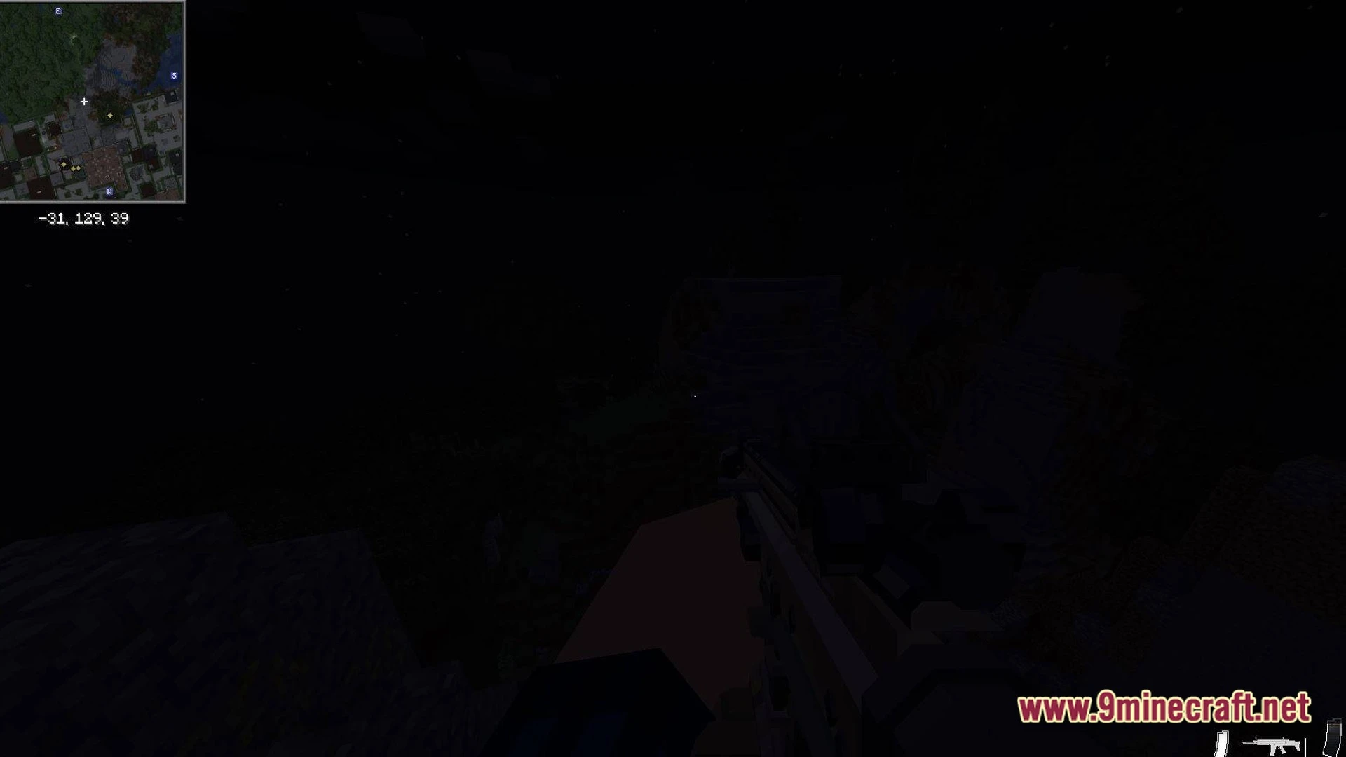 A first-person view of a player holding a firearm during nighttime in a dark minecraft environment