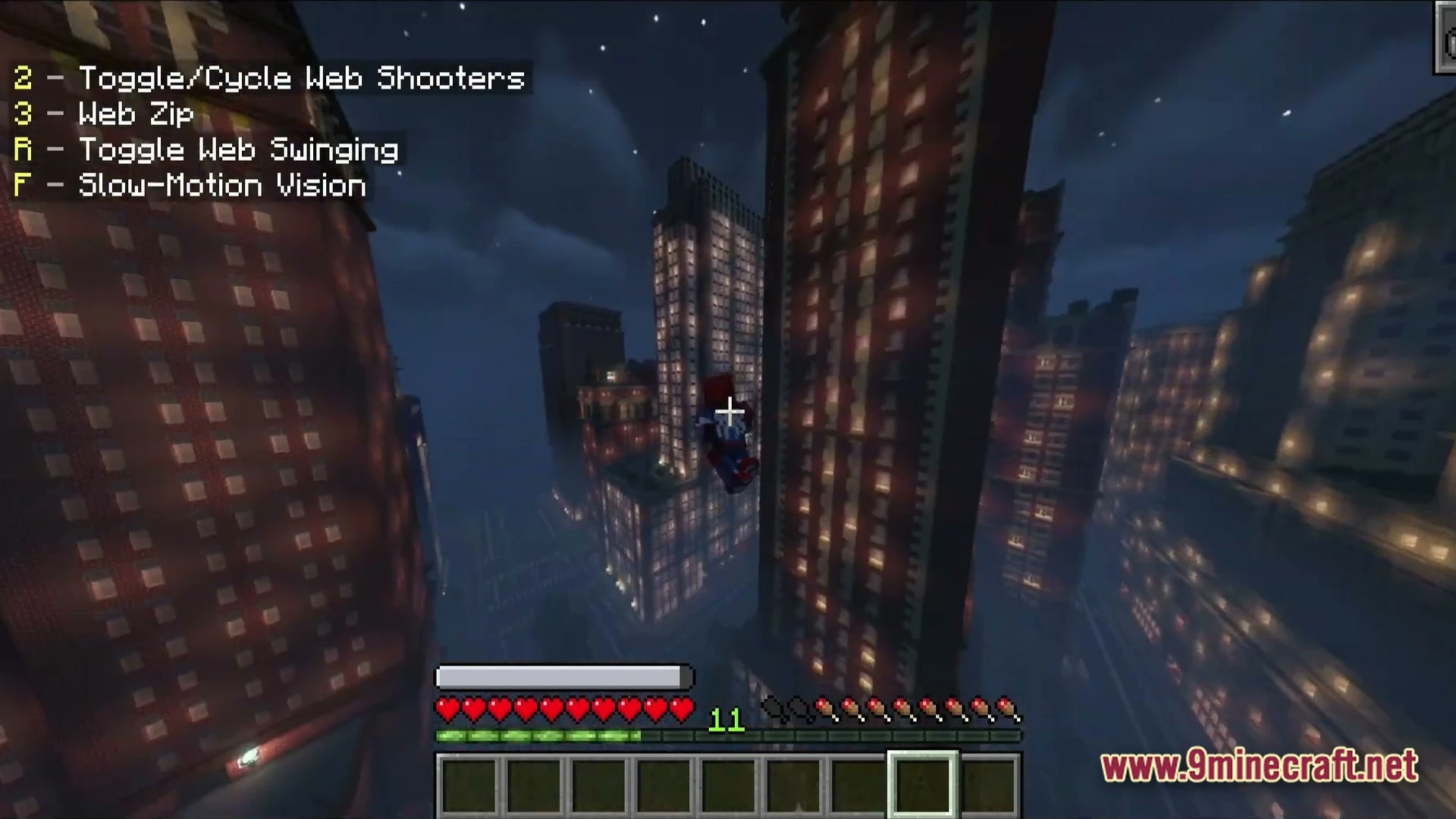 A player character in a superhero suit flies through a dense city of illuminated skyscrapers at night
