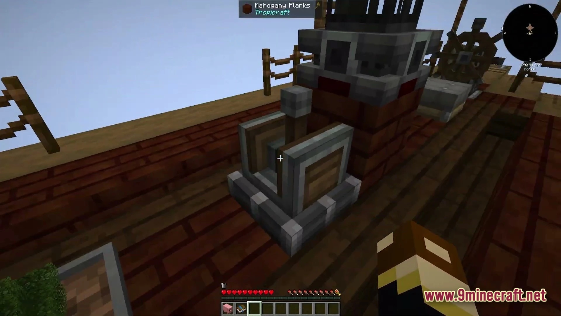 Vessel Of The Void Modpack (1.21.1) – Fly Craft And Conquer 6 A mechanical lever and steering wheel on a wooden ship deck made of mahogany planks