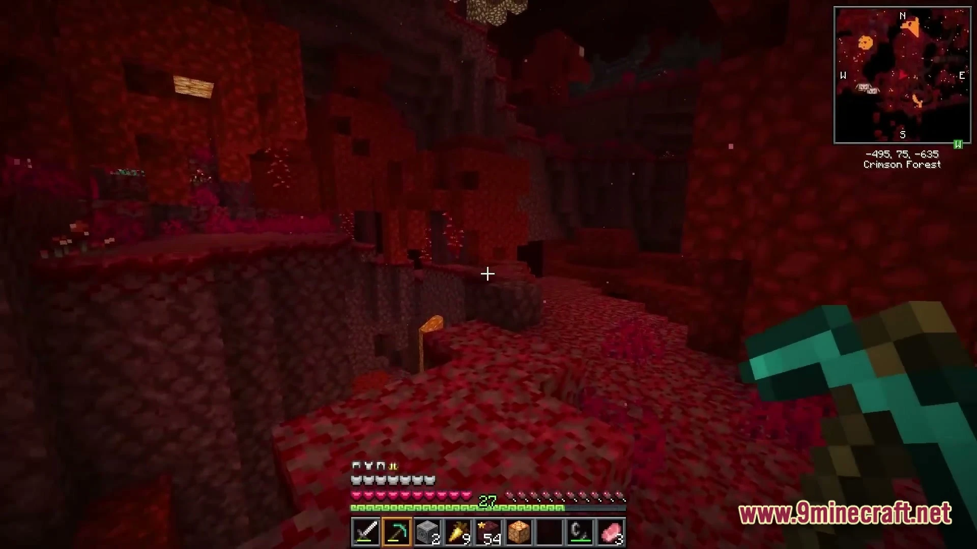 Vividia Horizon Modpack (1.21.10) – Fresh Animations Dimensions And Building 3 A player explores a crimson forest biome in the nether while holding a diamond pickaxe